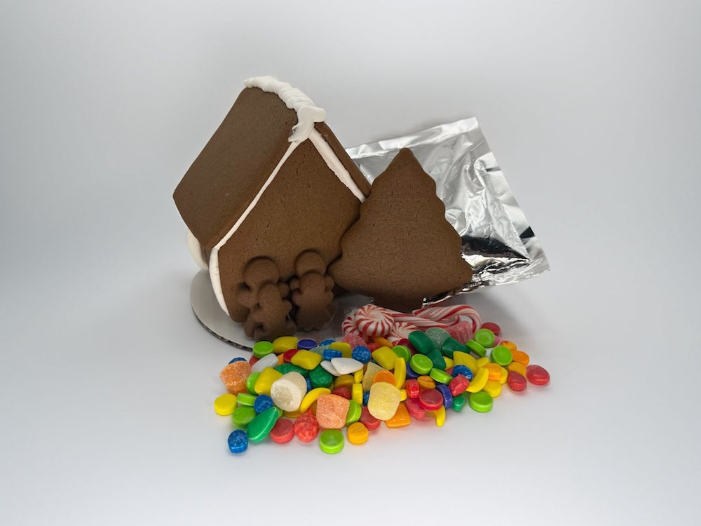 Gingerbread house with candy on a white background