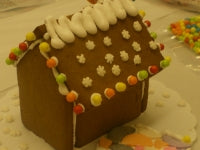 Gingerbread house with white icing on a table