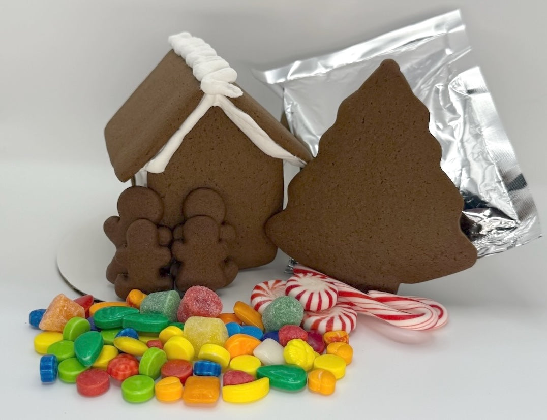 Gingerbread house with candy on a white background