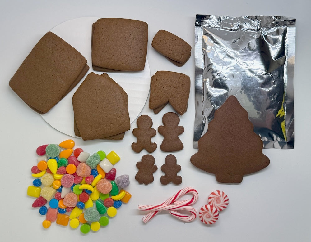 Cabin gingerbread house kit, unassembled with chimney, people and tree. Candy and one icing pack