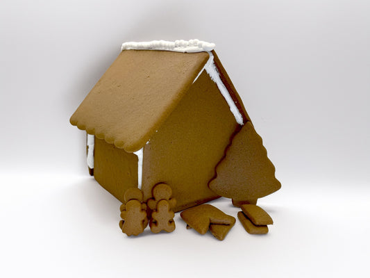 Gingerbread house with gingerbread people on a white background
