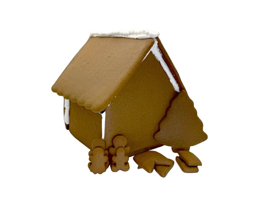 Gingerbread house with gingerbread people on a white background