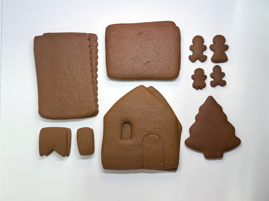 Gingerbread shop kit pieces on a white background