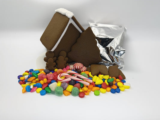 Gingerbread house kit with candy on a white background